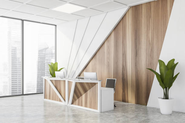 istock White and wooden reception in office corner 1269696477