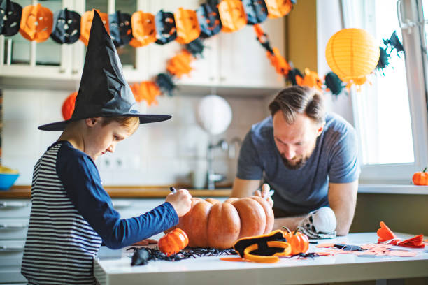 istock Father and son getting ready for Halloween party at home 1269697640
