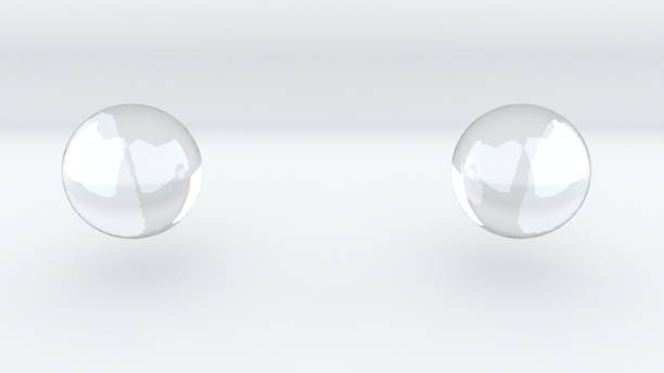 istock 3D rendering abstract background. Computer generated two glass metaballs merge into one 1269700483