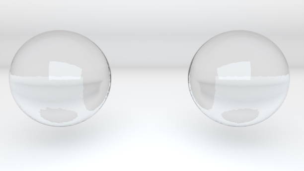 istock 3D rendering abstract background. Computer generated two glass metaballs merge into one 1269700493
