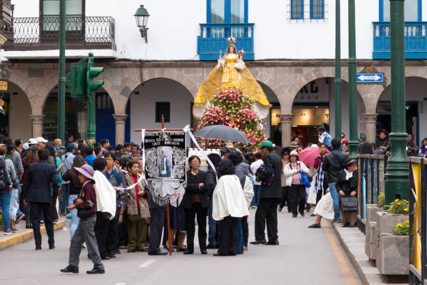 Parade in the historic center of Cusco, Peru. Cusco, Peru - october 08, 2018: People take part in the religious parade of the Virgin of the Rosary and walk in the historic center of Cusco in traditional masks and dresses, in Cusco, Peru. ethnic cleansing stock pictures, royalty-free photos & images