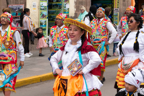 Parade in the historic center of Cusco, Peru. Cusco, Peru - october 08, 2018: People take part in the religious parade of the Virgin of the Rosary and walk in the historic center of Cusco in traditional masks and dresses, in Cusco, Peru. ethnic cleansing stock pictures, royalty-free photos & images