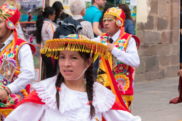 Parade in the historic center of Cusco, Peru. Cusco, Peru - october 08, 2018: People take part in the religious parade of the Virgin of the Rosary and walk in the historic center of Cusco in traditional masks and dresses, in Cusco, Peru. ethnic cleansing stock pictures, royalty-free photos & images