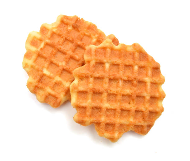istock Freshly baked belgian waffles isolated on white background 1269700982