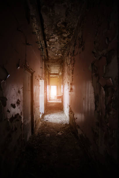 istock Dark creepy corridor of abandoned building 1269701036