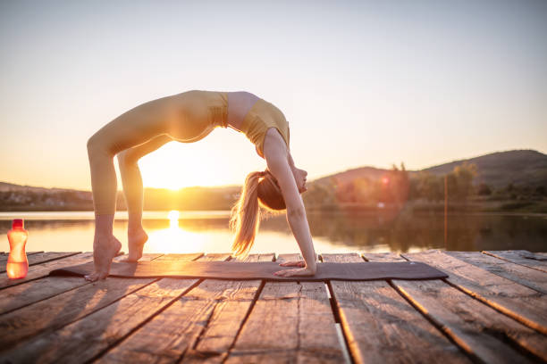 istock Woman practicing yoga poses in nature 1269703425