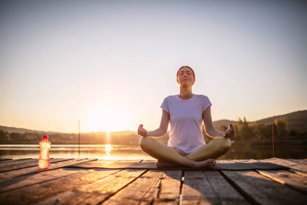 istock Woman practicing yoga poses in nature 1269703610