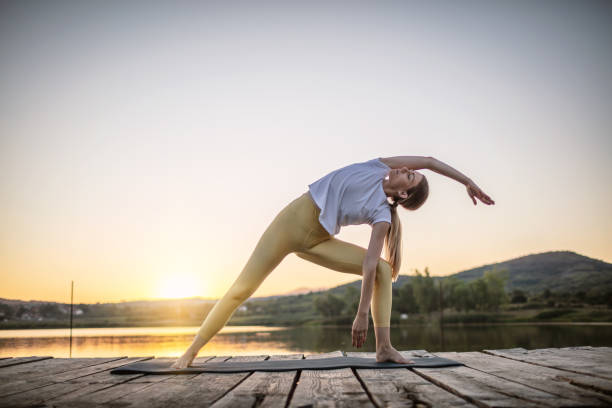 istock Woman practicing yoga poses in nature 1269704946
