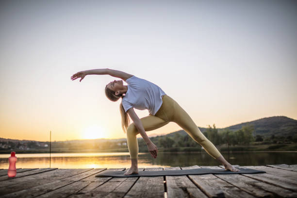 istock Woman practicing yoga poses in nature 1269705018