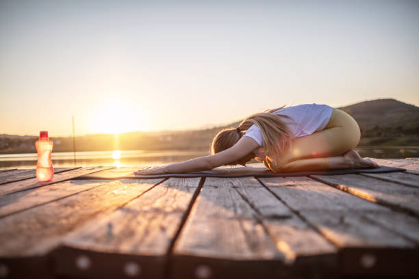istock Young woman stretching body in nature 1269708323