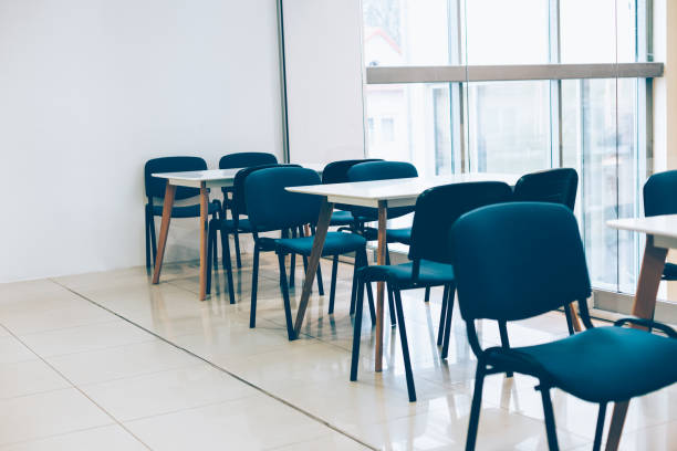 istock Coworking room space with tables and chairs 1269708596
