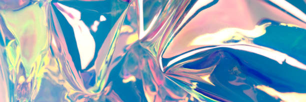 istock Multicolored holographic background. Defocused wrinkled iridescent foil. Creative banner. 1269710571