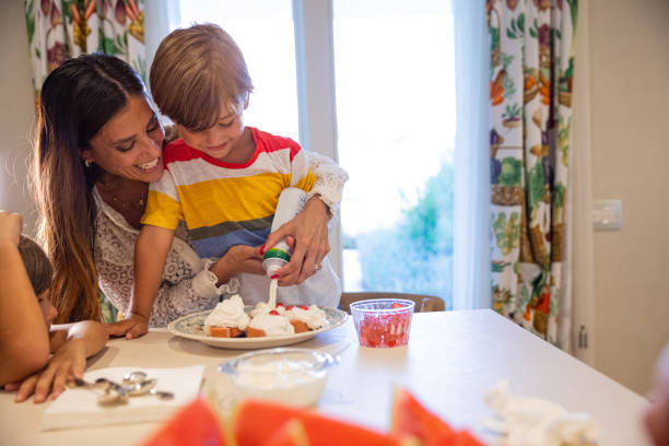 istock Young mother with her sons baking in the kitchen 1269711579