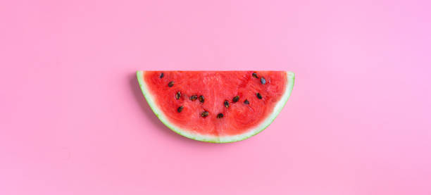 istock Slice of watermelon on a pink background 1269713036