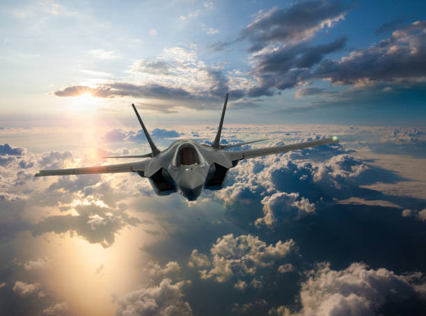 istock F-35 Fighter Jet flying over ocean at sunset 1269714269