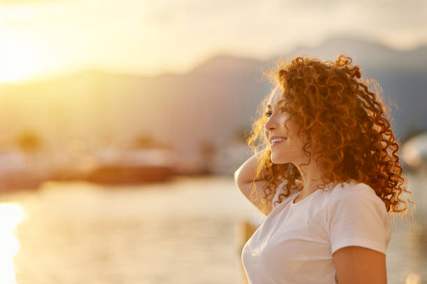 istock Red head Woman portrait on the beach 1269715451