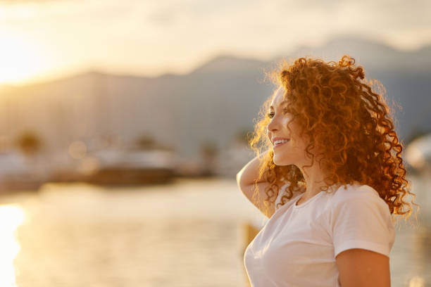 istock Red head Woman portrait on the beach 1269716369