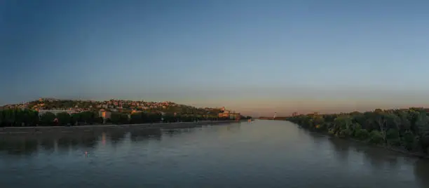 Photo of Bratislava capital in summer evening with color sunset and river Donau