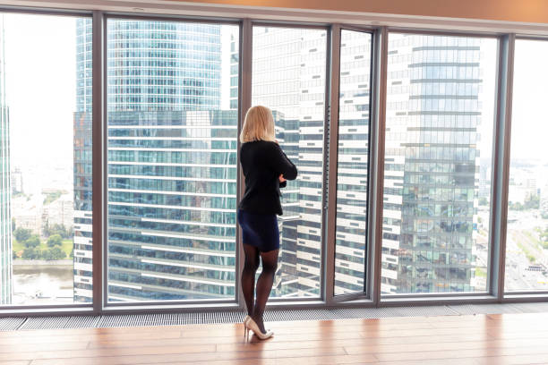 istock business woman stands in office 1269717896
