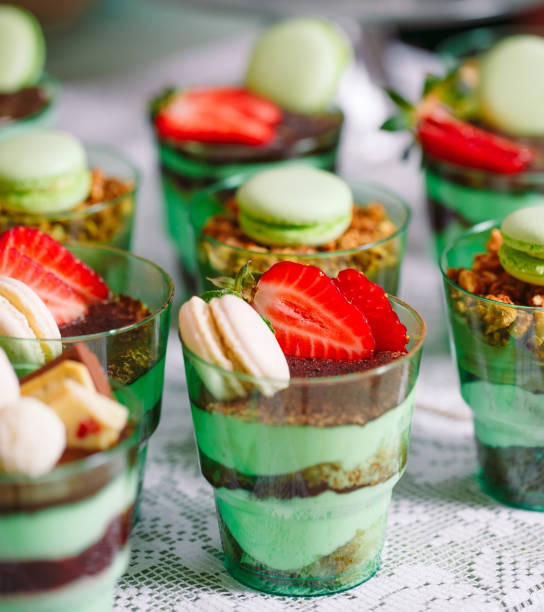 istock Trifles in plastic glasses with fresh fruit and cream. 1269718665