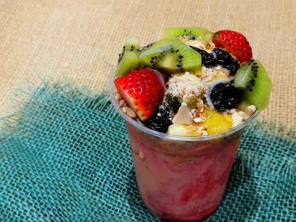 istock Fresh fruit salad with honey and nutsy 1269724789