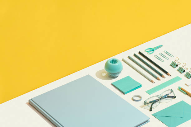 istock Blue stationary flat lay on yellow and white background 1269728344
