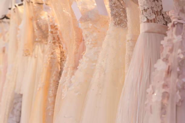 istock Wedding dresses hang on a hanger in a row 1269728523
