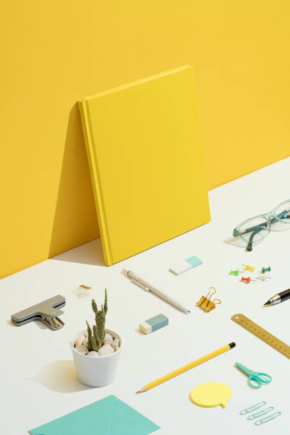istock Stationary flat lay on yellow and white background 1269729555