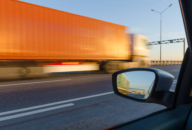 istock High speed traffic: blurred side view from car window on truck moving fast on highway 1269729756