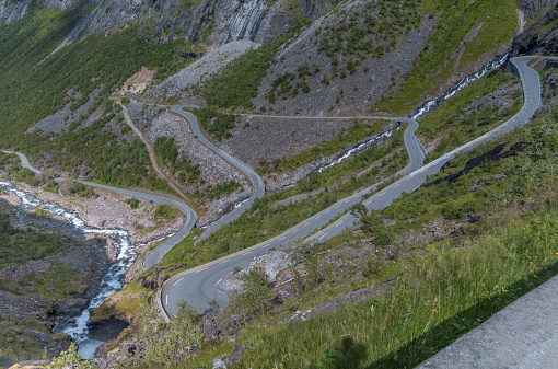 The thrilling Trollstigen ascent through a serpentine mountain road and pass in Rauma, MÃ¸re og Romsdal, Norway..With steep incline of 10% and eleven hairpin bends up a steep mountainside.