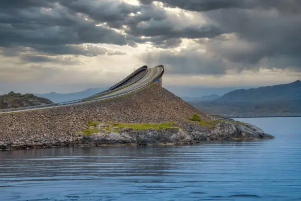Photo of Storseisundet Bridge., along the Atlantic Road, an 8.3-kilometer road that runs through an archipelago in More og Romsdal county, Norway. Built on several small islands and skerries, connected by causeways, viaducts and eight bridges.