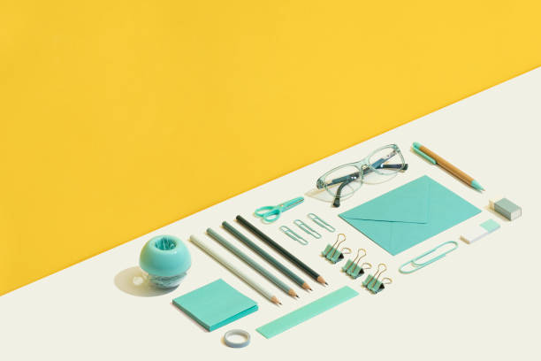 istock Blue stationary flat lay on yellow and white background 1269730684