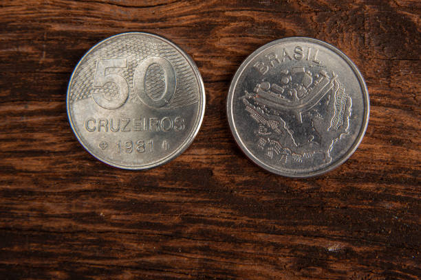 istock Old coins placed on a rustic wooden platform, top view. 1269731056
