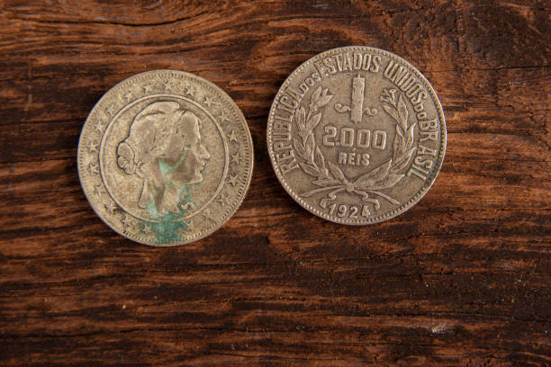 istock Old coins placed on a rustic wooden platform, top view. 1269731129