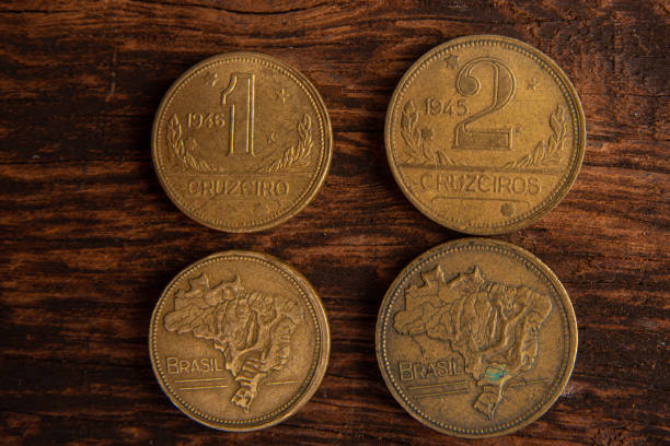 istock Old coins placed on a rustic wooden platform, top view. 1269731130
