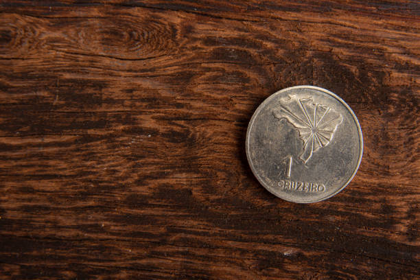 istock Old coins placed on a rustic wooden platform, top view. 1269731159