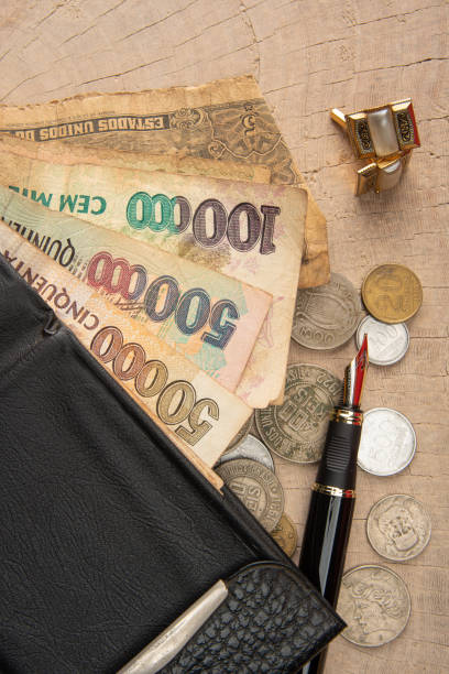 istock Old coins, fountain pen, wallet, cufflinks and more on a rustic wooden surface, selective focus. 1269731185