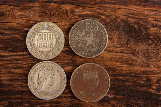 istock Old coins placed on a rustic wooden platform, top view. 1269731234