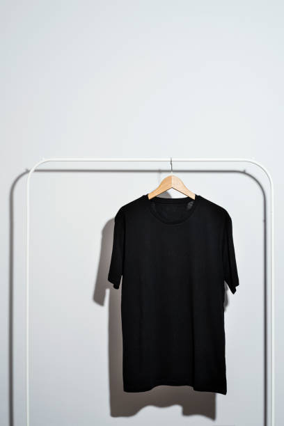 istock Black t-shirt displayed on clothes rack 1269731362