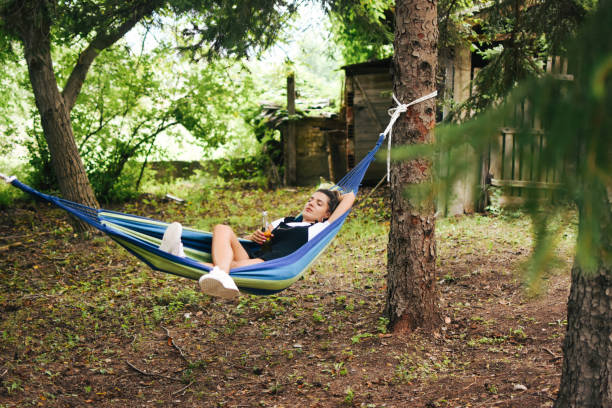 istock Beautiful woman enjoying in hammock 1269732200