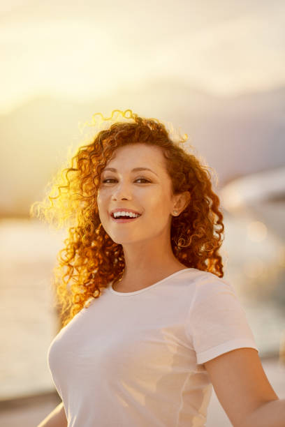 istock Red head Woman portrait on the beach 1269734566
