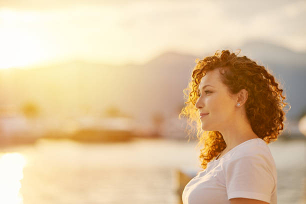 istock Red head Woman portrait on the beach 1269734763
