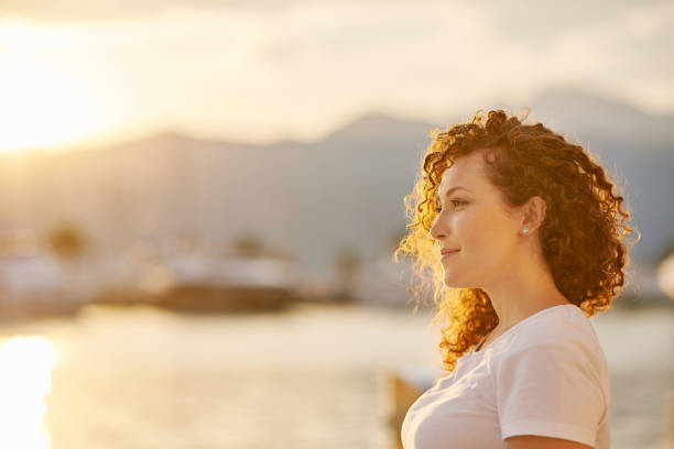 istock Red head Woman portrait on the beach 1269734882