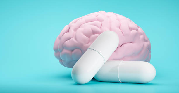 White Pills on blue background White Pills on blue background with brain model pill bottle photos stock pictures, royalty-free photos & images