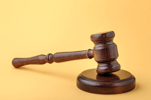 istock Gavel and soundboard on yellow 1269736043