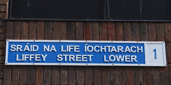 Liffey Street Lower sign in English language and translated directly into the Irish language, in Dublin city centre.