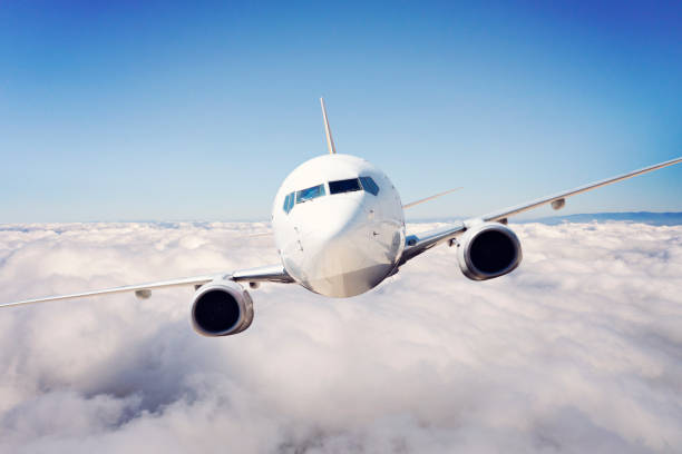 istock Passenger jet airplane flying above clouds. 1269738371