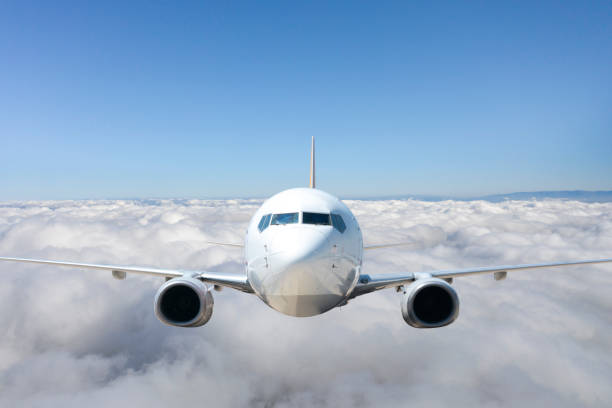 istock Passenger jet airplane flying above clouds. 1269738883