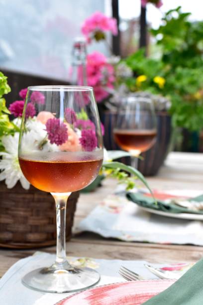 outdoor al fresco dining setting at romantic cozy cafe in beautiful patio setting to enjoy a lovely evening in warm weather - autumn table setting flower imagens e fotografias de stock