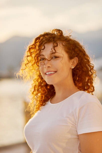 istock Red head Woman portrait on the beach 1269741172
